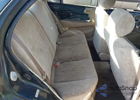 1999 Toyota Corolla Le z USA, uszkodzony, nr VIN 1NXBR12E5XZ201923